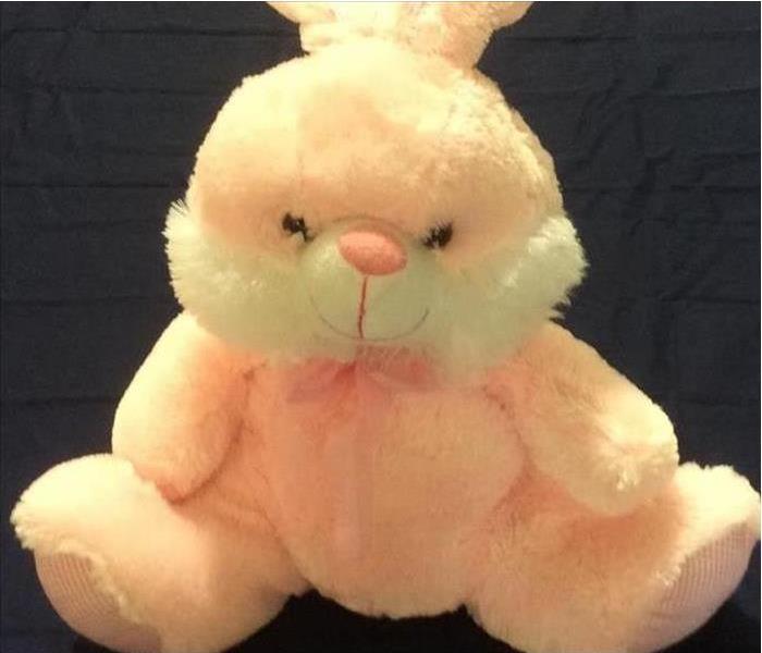 Pink stuffed bunny completely free of soot