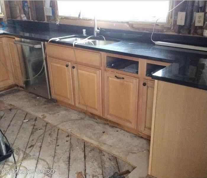 Kitchen cleared of water and dried with flooring removed
