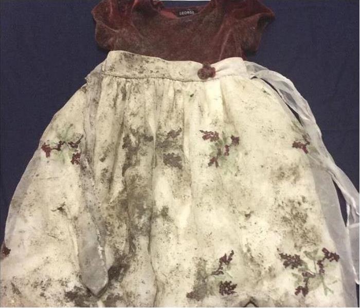 White and red dress covered in soot