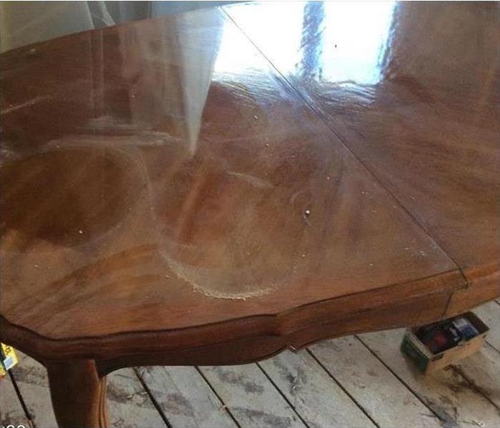 A wood table affected by smoke from a fire